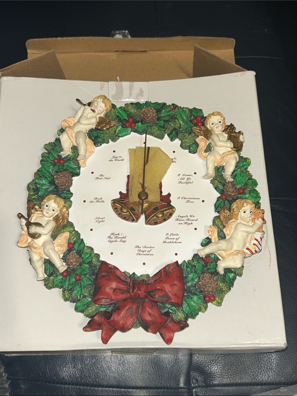 Musical Christmas Wreath Clock with Cherubs, sings a different song every hour